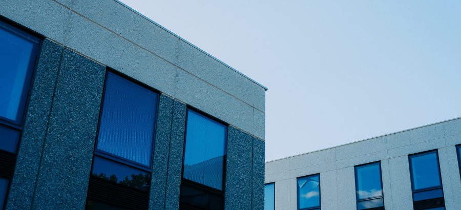 Two buildings with a blue tint